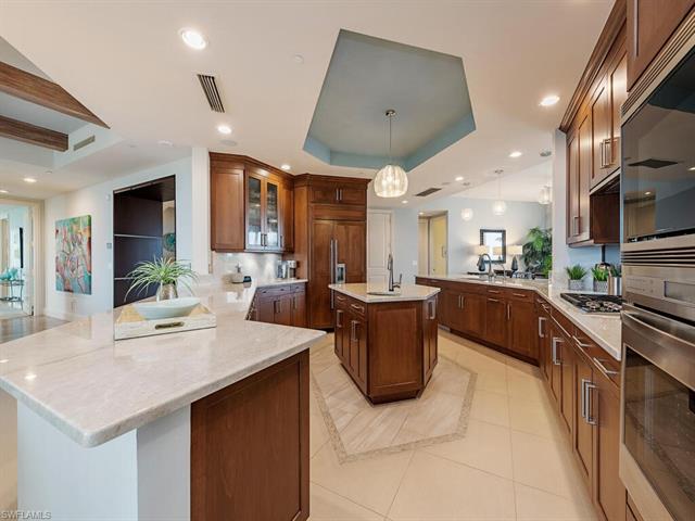 Gourmet kitchen with Wolf gas cooktop, Wolf microwave and wall self-cleaning oven.  Island with sink and disposal for the couple that cooks together.