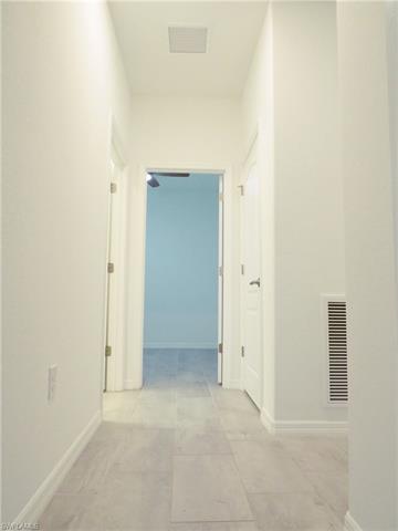 View of hall between bedrooms
