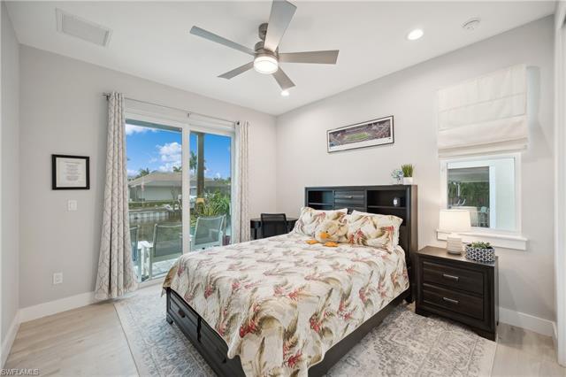 Bedroom featuring ceiling fan, light wood-type flooring, and access to exterior
