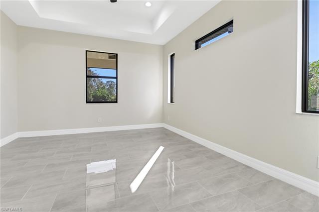 Unfurnished room featuring a raised ceiling
