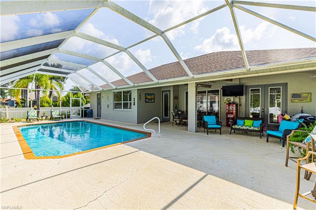 View of swimming pool with a patio and a lanai