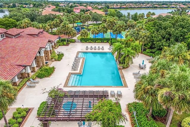 View of pool with a water view and a patio area