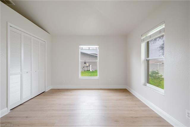 Unfurnished bedroom with light wood-type flooring