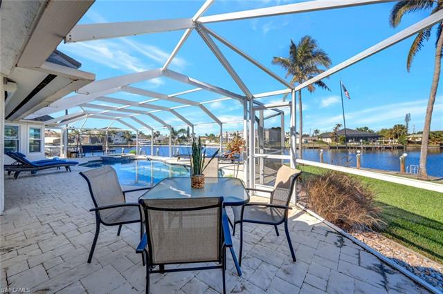 View of patio / terrace with a lanai and a water view