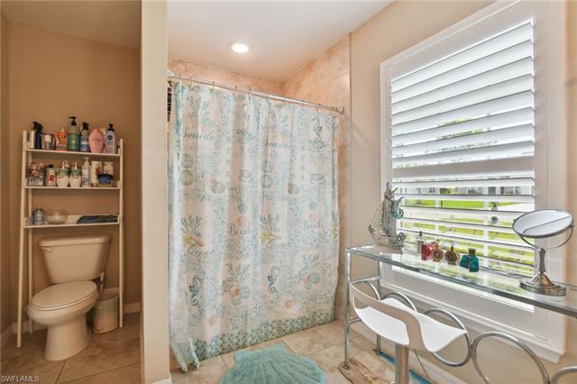Bathroom featuring tile patterned flooring and toilet