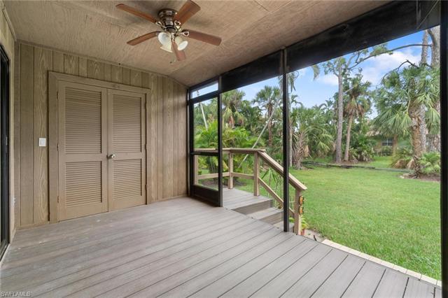 Unfurnished sunroom with ceiling fan