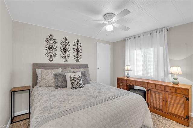 Bedroom featuring ceiling fan and walk-in closet