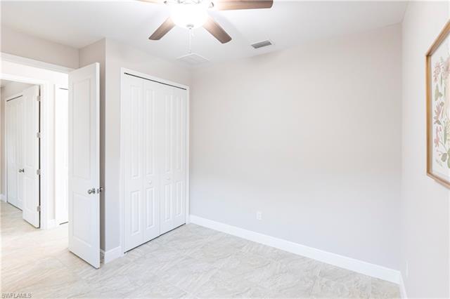Unfurnished bedroom featuring ceiling fan and a closet