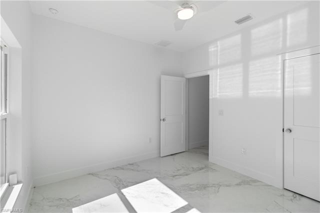 Unfurnished bedroom with ceiling fan