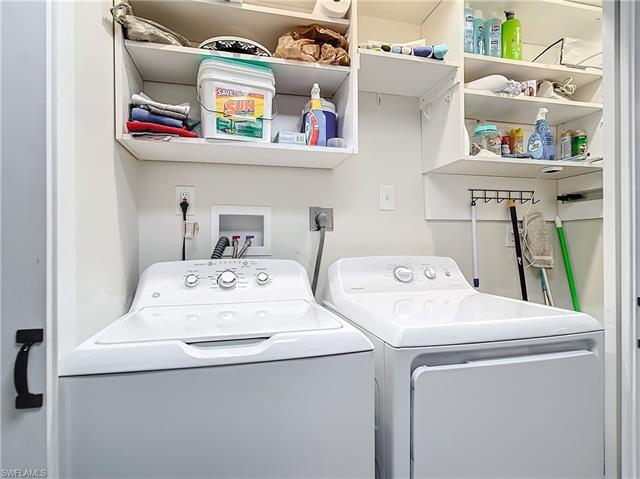 Clothes washing area featuring independent washer and dryer