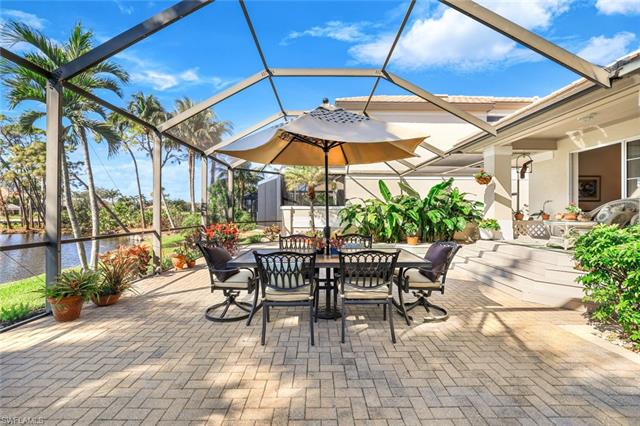 View of patio with a lanai