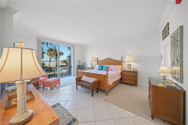 Tiled bedroom with access to outside and ornamental molding