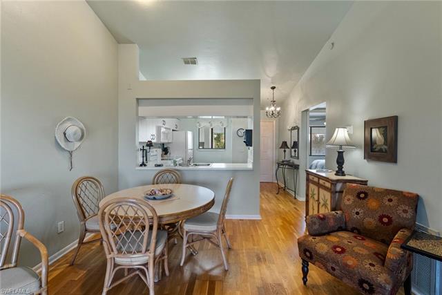 Dining space with an inviting chandelier, sink, and light wood-type flooring