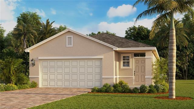 View of front of property featuring a garage and a front yard