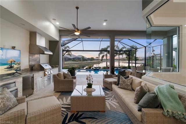 Patio terrace at dusk featuring area for grilling, an outdoor living space, grilling area, and a lanai