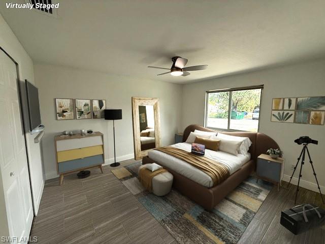 Bedroom with ceiling fan, baseboards, and wood finished floors