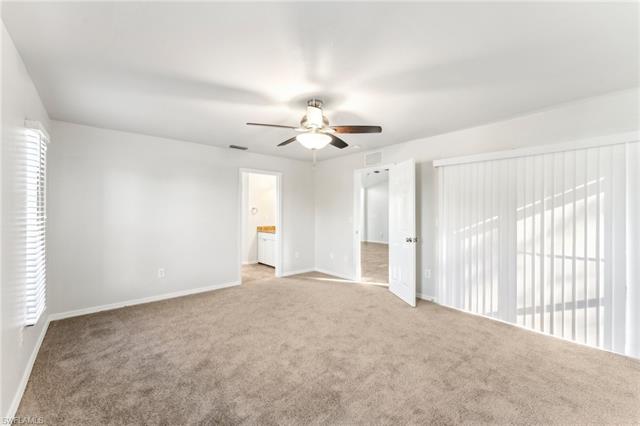 Unfurnished room with light carpet and ceiling fan