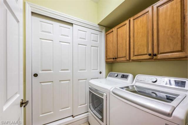 Laundry area with cabinet space and washer and dryer