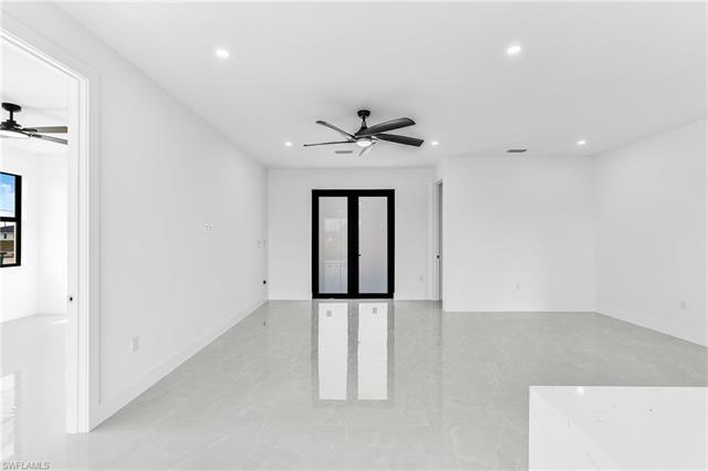 Spare room featuring ceiling fan, visible vents, baseboards, and recessed lighting