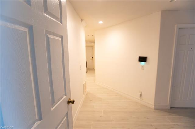 Hall featuring recessed lighting, baseboards, and light wood finished floors