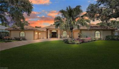 Mediterranean / spanish-style home with an attached garage, stucco siding, decorative driveway, and a front yard