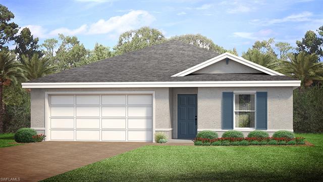 View of front of property with a front yard and a garage