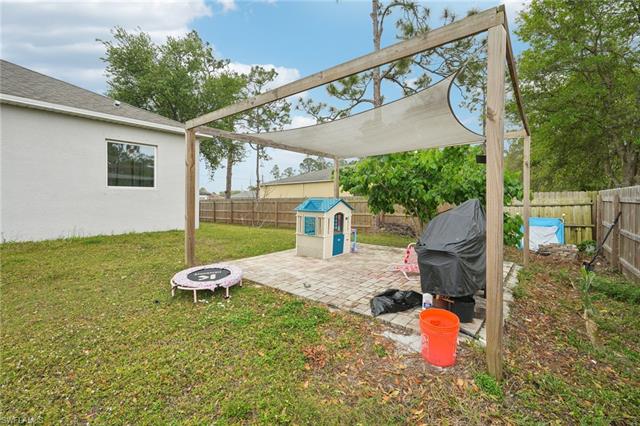 View of yard with a fenced backyard and a patio area
