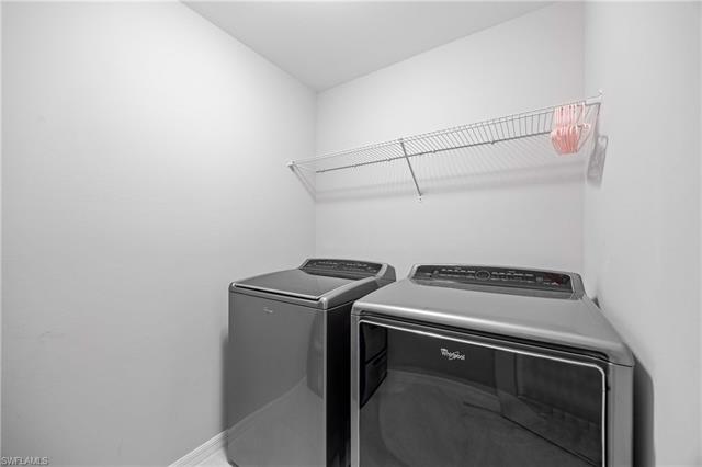 Laundry room with washing machine and dryer