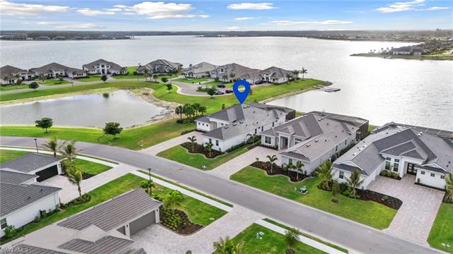 Aerial view featuring a residential view and a water view