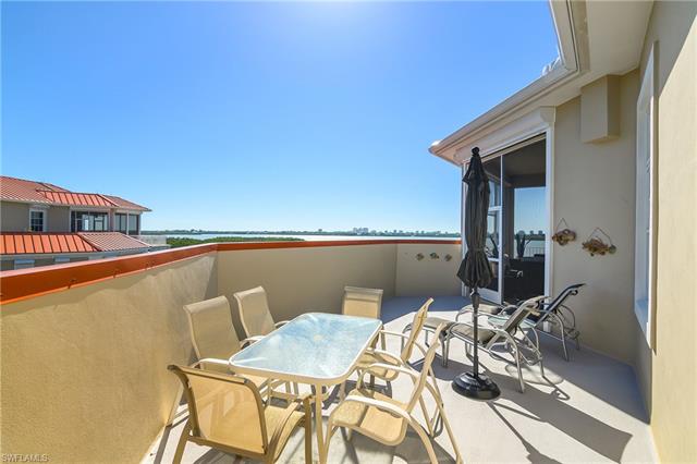 View of patio featuring a balcony