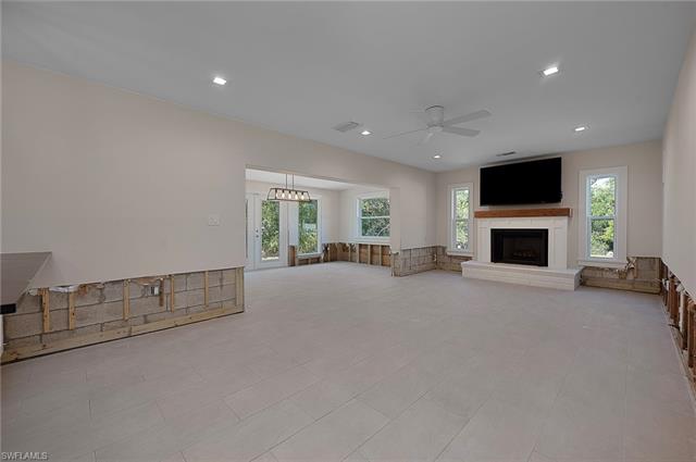 Living room features a wood burning fireplace.