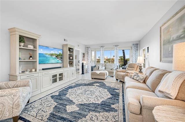 A beautifully designed living space featuring custom built-ins and a seamless indoor-outdoor flow.