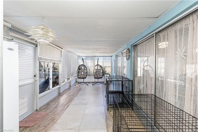 Sunroom with a ceiling fan