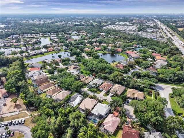 Drone / aerial view with a residential view and a water view