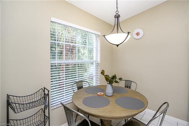 Tiled dining space featuring baseboards