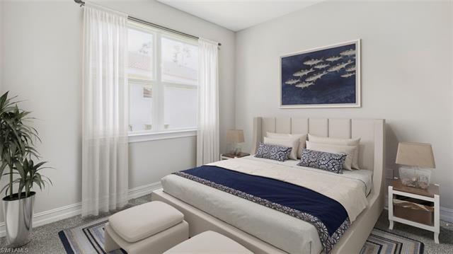 Bedroom featuring carpet flooring and baseboards