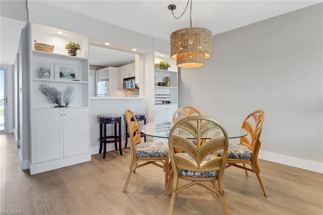 Dining space featuring recessed lighting, baseboards, light wood-type flooring, and an inviting chandelier