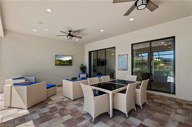 View of patio / terrace with a ceiling fan and outdoor dining space