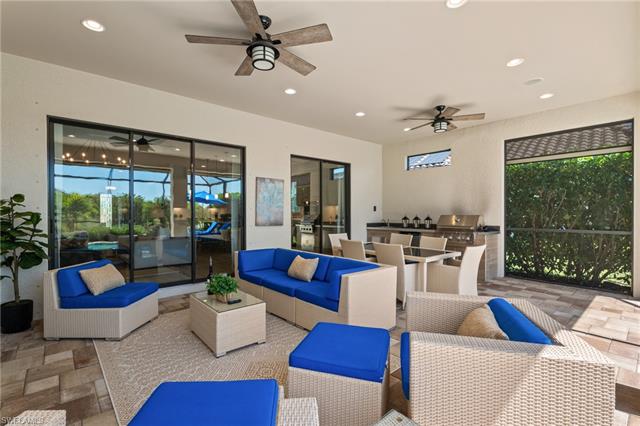 View of patio / terrace featuring grilling area, an outdoor hangout area, exterior kitchen, and ceiling fan