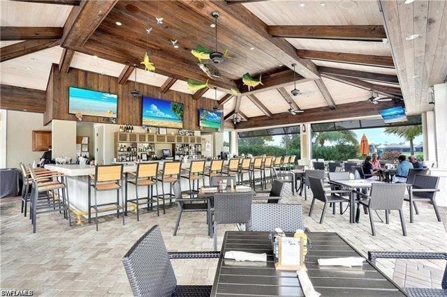 Dining space featuring beamed ceiling, high vaulted ceiling, wooden walls, and wooden ceiling