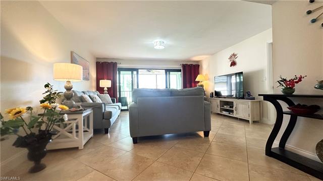 Living room featuring light tile patterned floors
