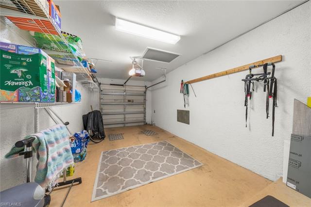 Garage featuring an automatic garage door opener