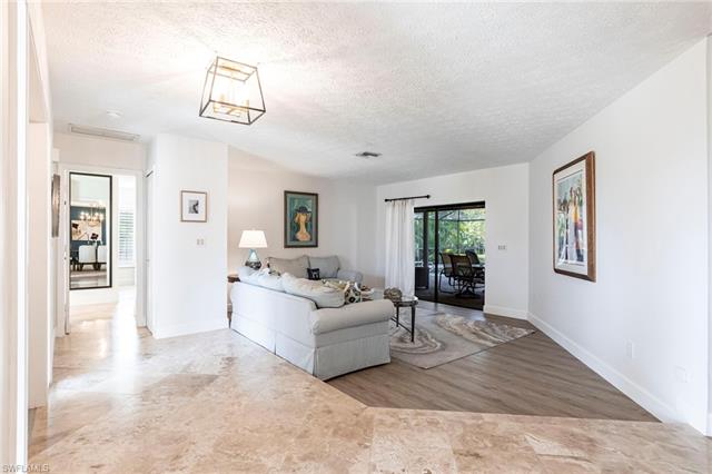 Living area with  baseboards, and visible vents, lvp flooring