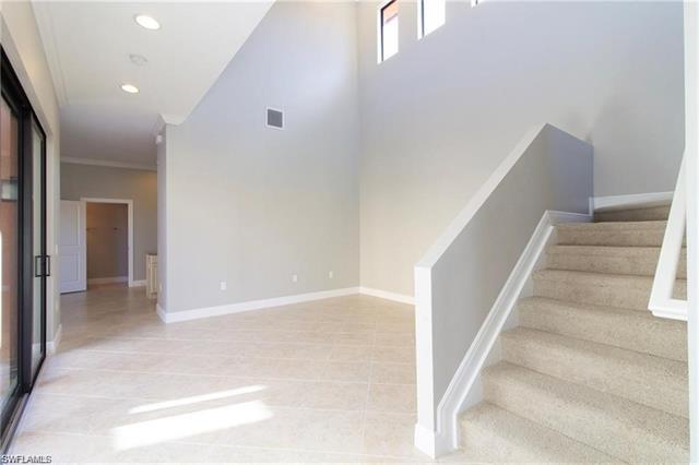 Staircase with, recessed lighting, ornamental molding, baseboards, and visible vents