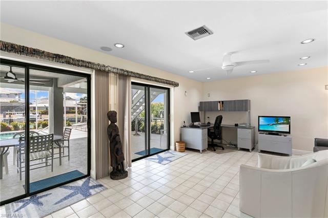 Office space with visible vents, recessed lighting, light tile patterned floors, and a ceiling fan