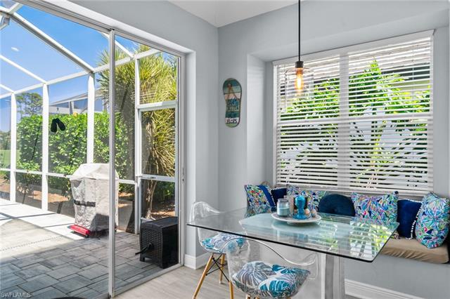 Dining area featuring a sunroom and wood finished floors